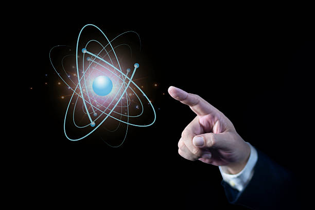 istock Businessman hand pointing creative atom. Nuclear fusion concept, endless energy, cheap electricity, Innovative technologies, Future technologies. Science and future concept 2203354762