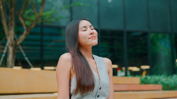 istock Businesswoman taking a break after working 2203355754