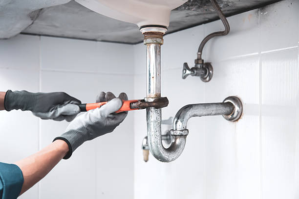 istock Technician plumber using a wrench to repair a water pipe under the sink. Concept of maintenance, fix water plumbing leaks, replace the kitchen sink drain, cleaning clogged pipes is dirty or rusty. 2203361131