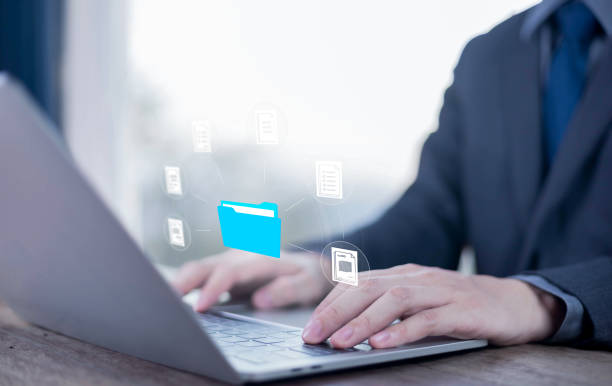 istock Show document management system on laptop. Managing corporate file information, Efficient document management with technology software for archiving, document, technology, quality, file 2203361650