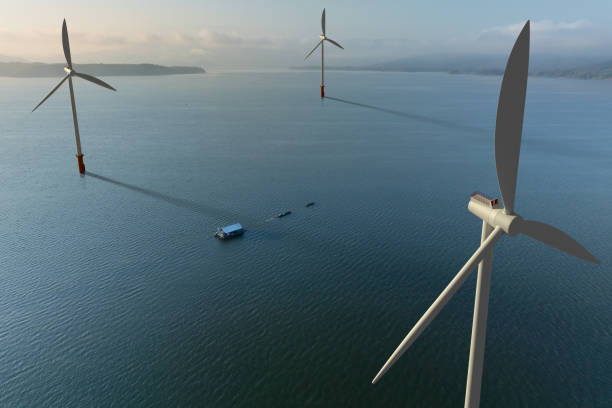 istock Wind Turbines on Lake with Local Boats Passing By 2203362309
