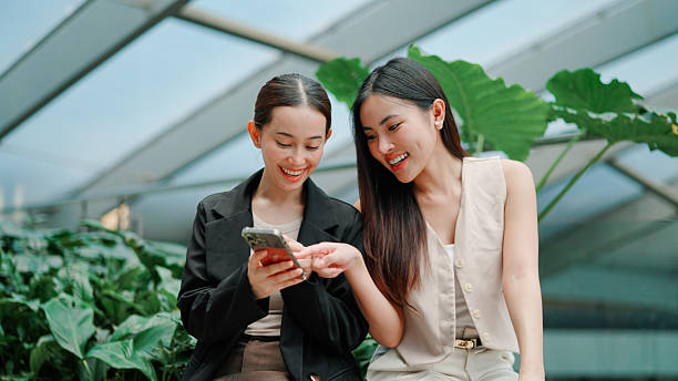 Two friend shopping on phone
