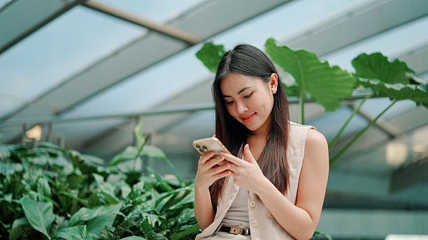 istock Asian woman using smartphone in resting time 2203363726
