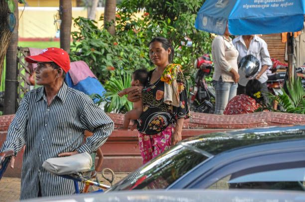 Phnom Penh, Cambodia - May 6, 2009: A bustling street scene with locals going about their daily activities, capturing the essence of urban life in the capital city.