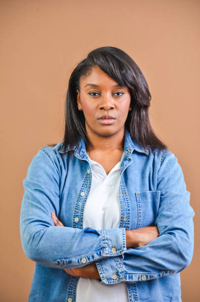 istock Serious young woman crossing arms, looking at camera 2203365142