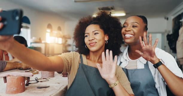 istock Women, vlog and pottery selfie in clay studio, workshop and art process for handmade ceramic design. Craft, hobby and artist friends with social media, artwork or painting in creative class for post 2203365295
