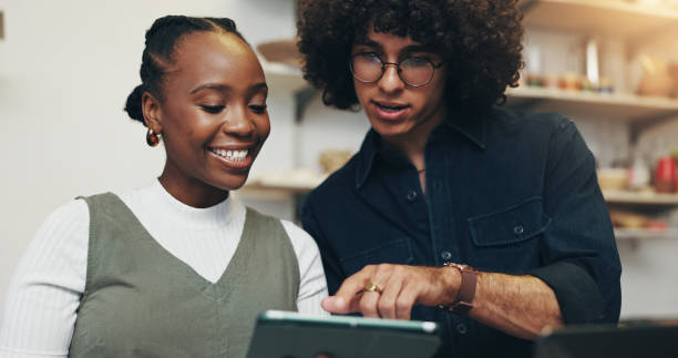 istock Workshop, people or startup with tablet for pottery, design inspiration or verification for order. Small business, man or woman as ceramist with scroll for clay ecommerce, track inventory or teamwork 2203365326