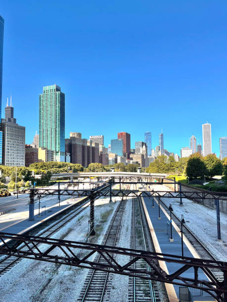 istock Old Chicago railroad shadowed by the city skyline 2203366130