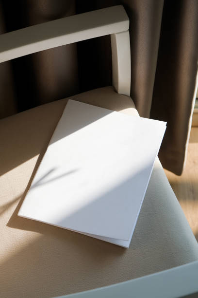 blank magazine mockup on soft armchair , shadow overlay