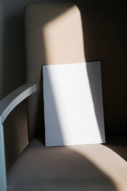 istock blank magazine mockup on soft armchair , shadow overlay 2203366879