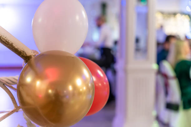 istock Colorful balloons at festive event with blurred background 2203367958