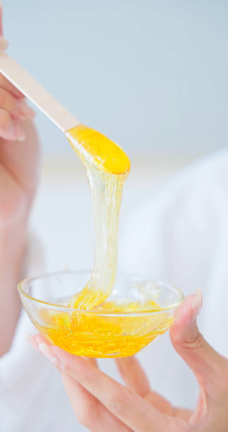 istock beauty hair removal hot wax 2203369763