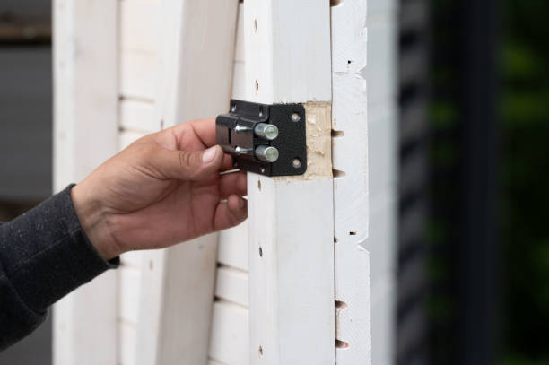 istock Installing a small door lock for a room in a gazebo. 2203369896