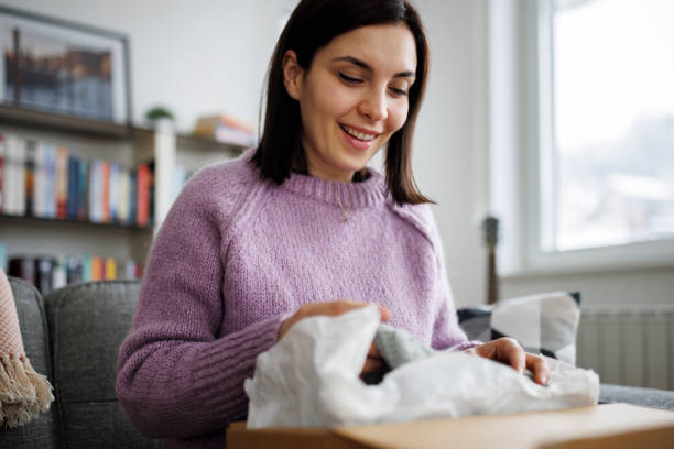 Woman enjoying unpacking her new purchase