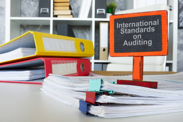 istock Documents and a sign international standards of auditing ISA. 2203373293