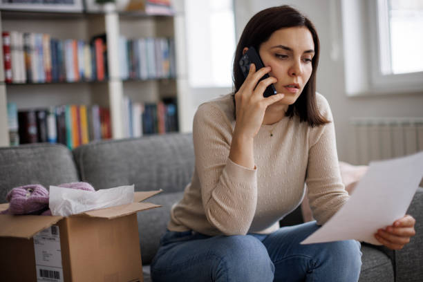 istock Female customer on the phone complaining about a mistake in her online purchase 2203373378