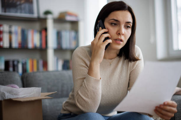 istock Frustrated woman contacting customer service about a delivery problem 2203373379