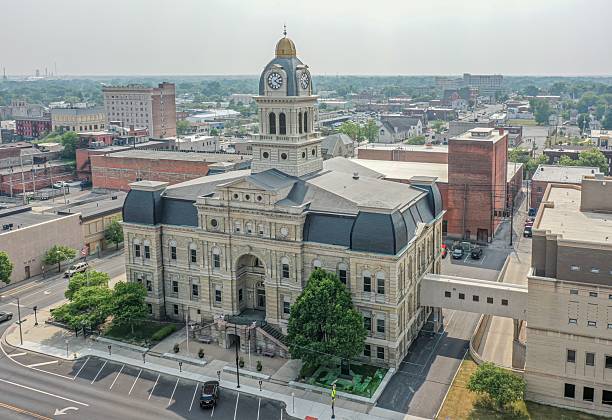 istock Historic courthouse with clock tower in cityscape 2203373403