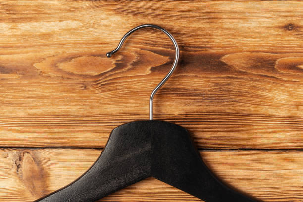 Wood cloth hangers on a white marble background