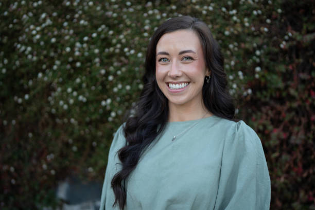 istock Smiling Woman in a Public Park 2203375924