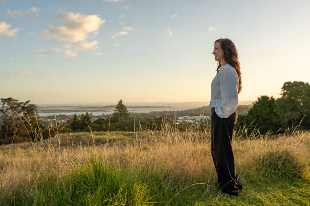 istock Standing Beautiful Woman Enjoying a Scenic View 2203376108