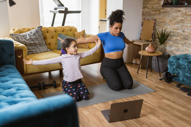 istock Home Workout with Mother and Daughter 2203377368