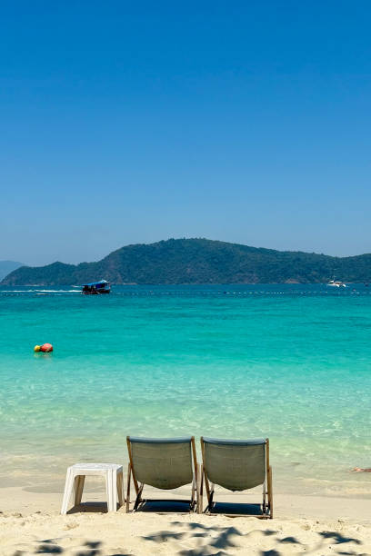 istock Turquoise Waters and Lounge Chairs in a Tropical Paradise 2203377560