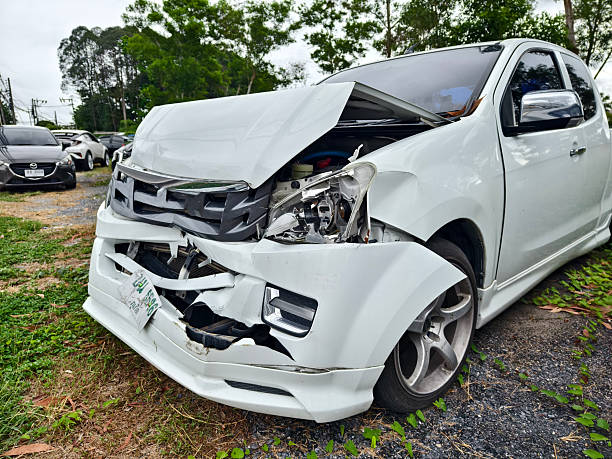 istock Abandoned cars after accidents in a dense overgrown setting 2203377713