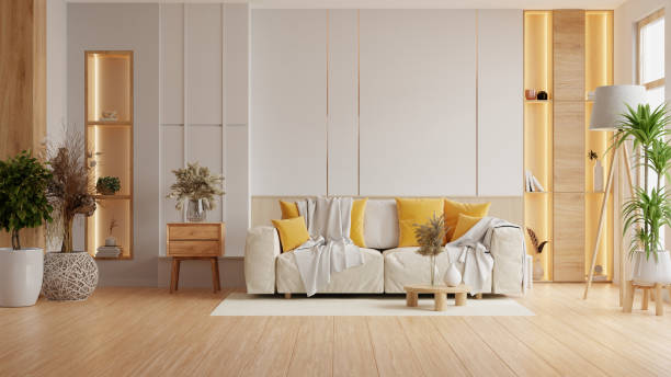 istock Modern interior living room features an sofa and decorative accessories against a white-colored wall- 3D rendering 2203378693