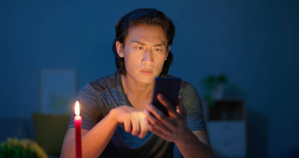 istock asian man with power outage 2203380967