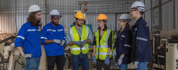 istock Workers Factory or Engineering work at factory site check up machine or products in site. Foreman or Technician checking Material or Machine on Plant. Heavy industry factory concept. 2203381904