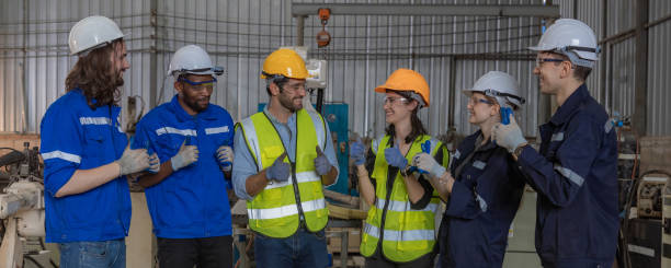 istock Workers Factory or Engineering work at factory site check up machine or products in site. Foreman or Technician checking Material or Machine on Plant. Heavy industry factory concept. 2203381917