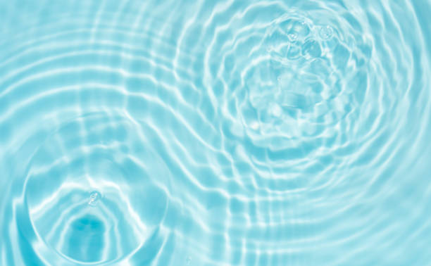 istock Water ripple surface, Summer backgrounds, Water waves abstract pattern texture on swimming pool,Top view poolside with light shadow on blue water 2203382158