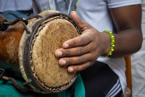 istock African man's hand playing traditional drum 2203383472