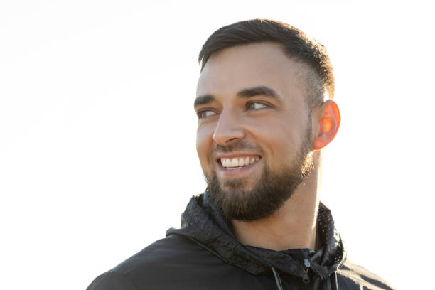 istock A young man looking at the nature around him and smiling 2203384442
