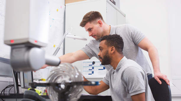 istock Two Male Engineers Uses CMM Coordinate Measuring Machine In Factory 2203384463