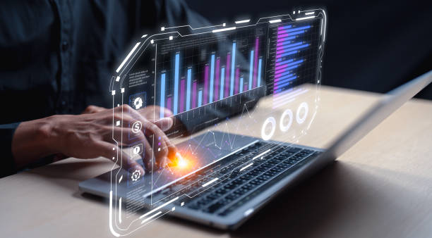 istock A person interacts with a laptop displaying vibrant graphs and data, symbolizing modern technology and analytics in a professional setting. 2203384637
