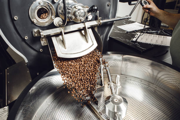 istock Freshly Roasted Coffee Beans Pouring Into Cooling Tray 2203385924