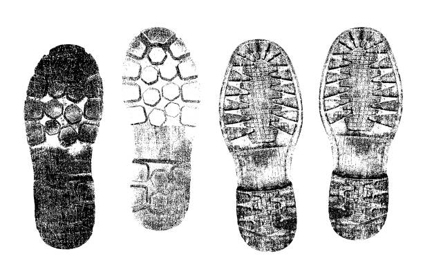 istock Shoe print set, black silhouette on snow, distressed, uneven, isolated. Dirt splash grunge texture. Vector print texture. Grunge design element. Shoes foot printing icon symbol vector set. 2203386026