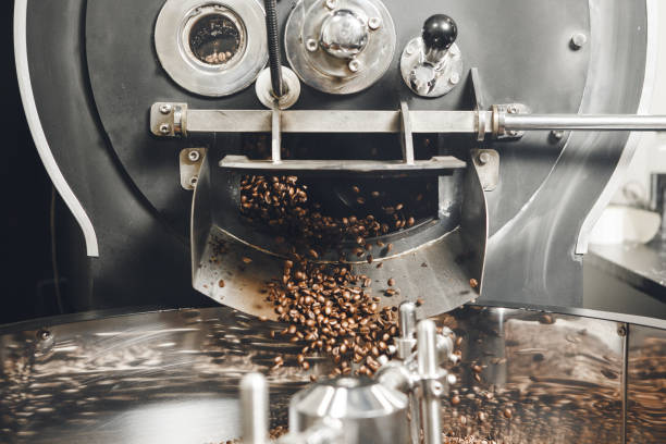 istock Roasted Coffee Flowing out From Roaster and Mixing 2203386068
