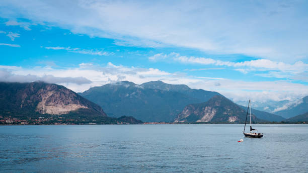 istock Sailing on Lake Maggiore under a clear sky in the Italian mountains 2203387281