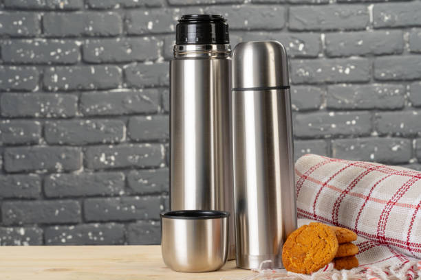 istock Aluminum metal thermos container bottle close up on table 2203387474