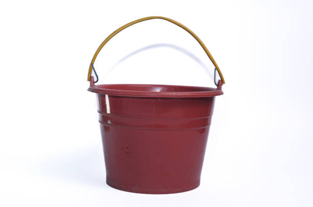 istock bucket with red paint on white background 2203389041