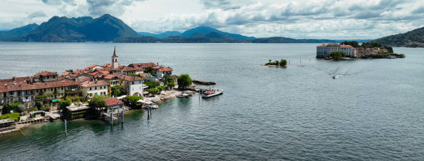 istock Isola Superiore features charming waterfront and historic buildings under a cloudy sky 2203390518