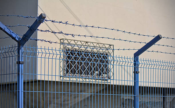 istock Wired fence around the prison 2203391797