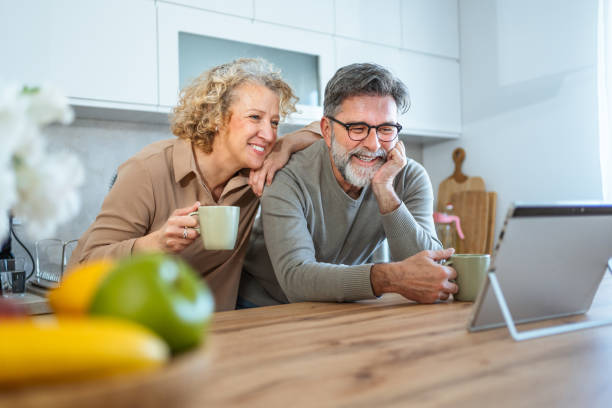 istock Mature couple exploring something on their tablet 2203392516