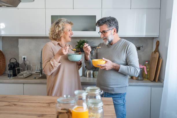 istock Mature couple having cereal for breakfast together 2203392543