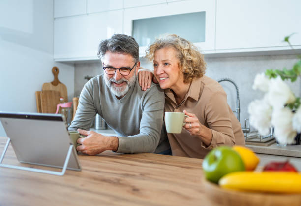 istock Mature couple exploring something on their tablet 2203392670