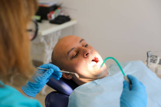 istock Female Dentist Preparing for Work, Holding Dental Instruments 2203393817