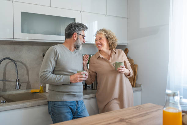 istock Mature couple chatting and drinking coffee in the morning 2203394200